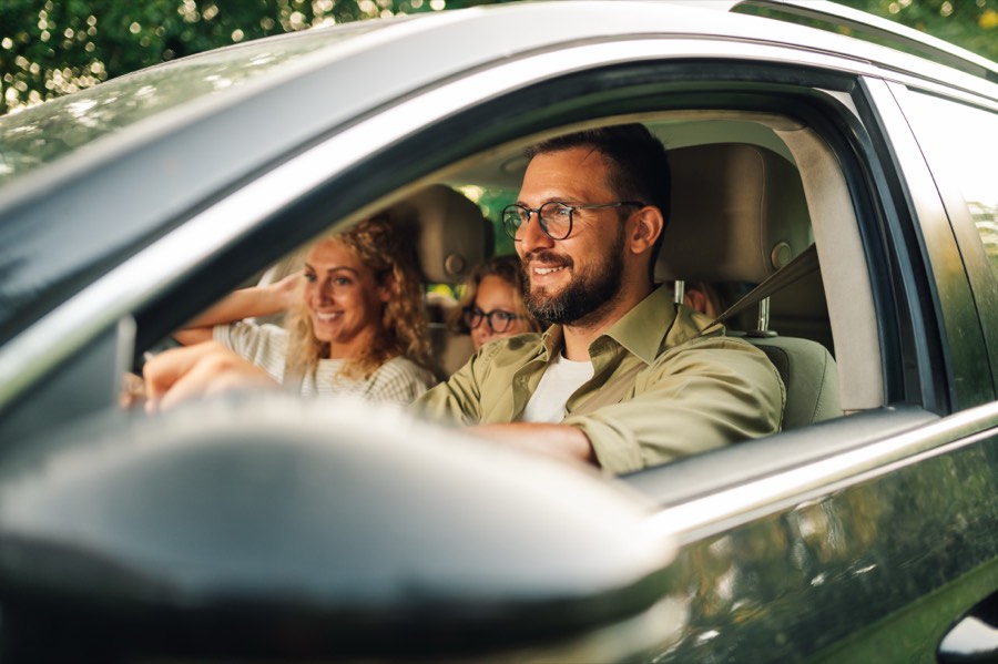 Family driving comfortably in a car