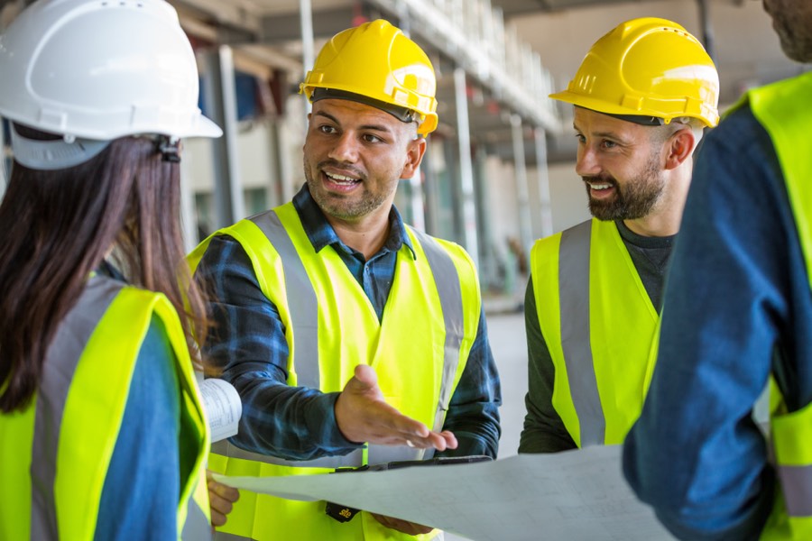Site workers talking over plans